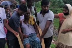 A physically challanged old man being evacuated to nearby shelter